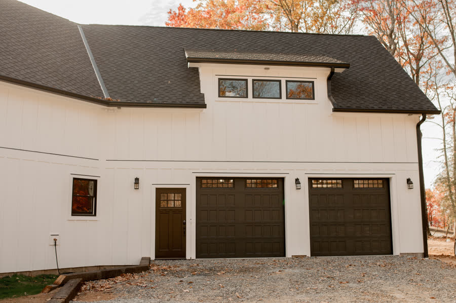 Custom modern farmhouse with an attached three-car garage