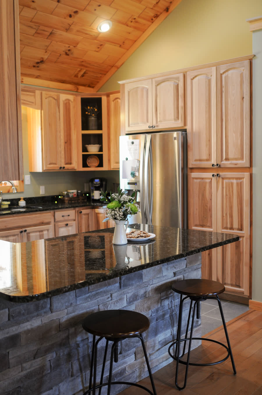 Renovated kitchen with hickory cabinets and granite counters by ARCH Home Crafters